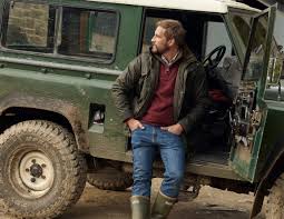 Barbour wax jacket worn with Land Rover and wellington boots